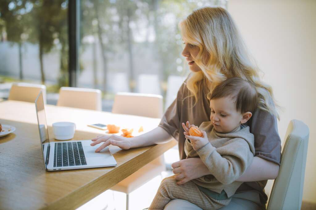 gifts for working moms - mom at computer with son