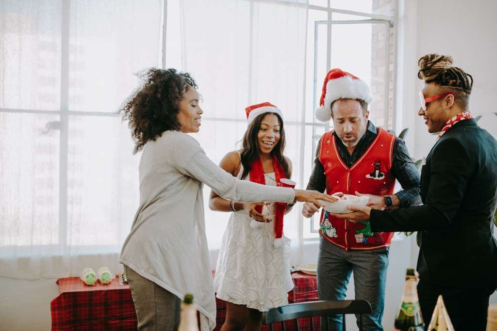 employees playing a holiday gift exchange game