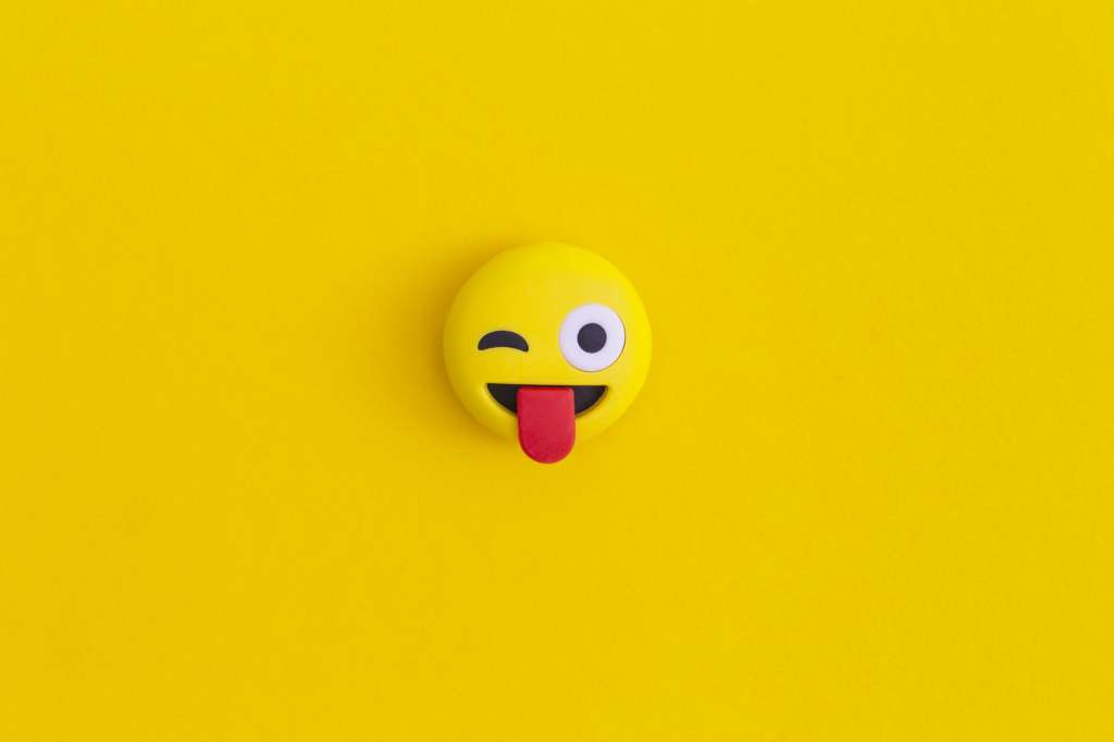 Emoticon smile on a yellow background